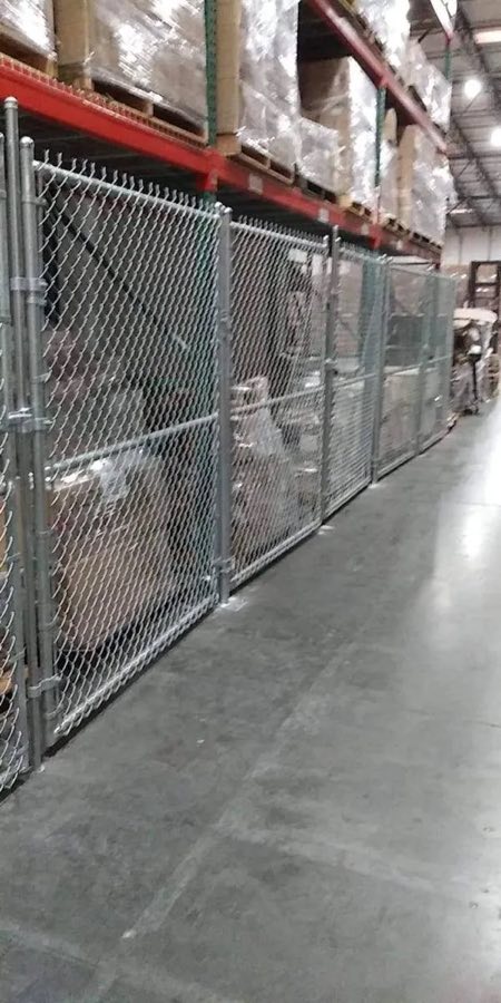 Chain link storage enclosures in a warehouse