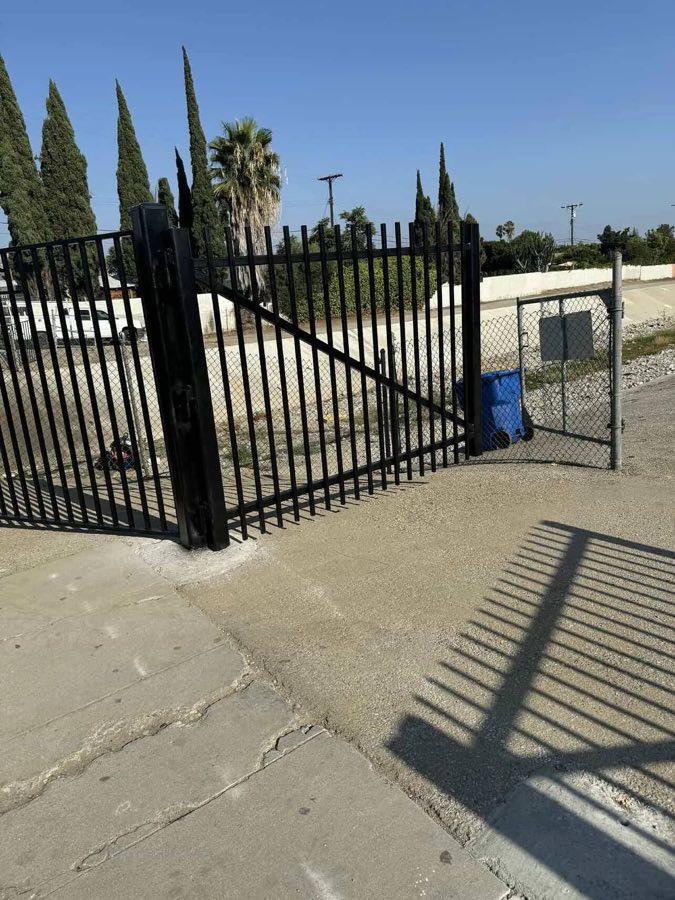 Black wrought iron sliding driveway gate