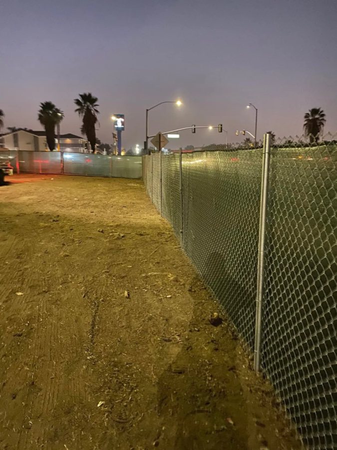 Chain link fence around an open lot